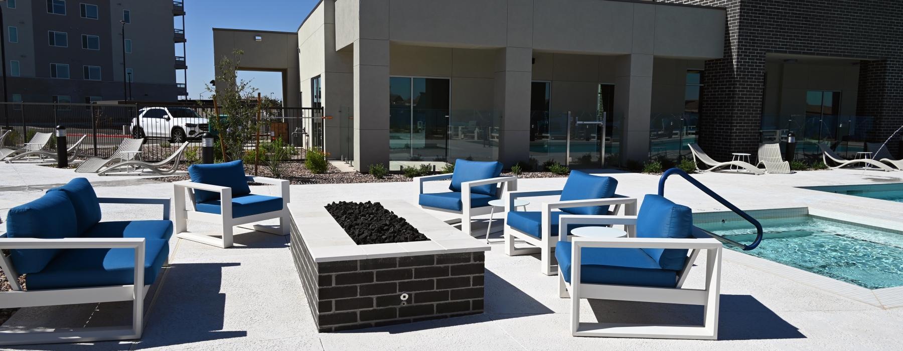 a swimming pool with chairs around it