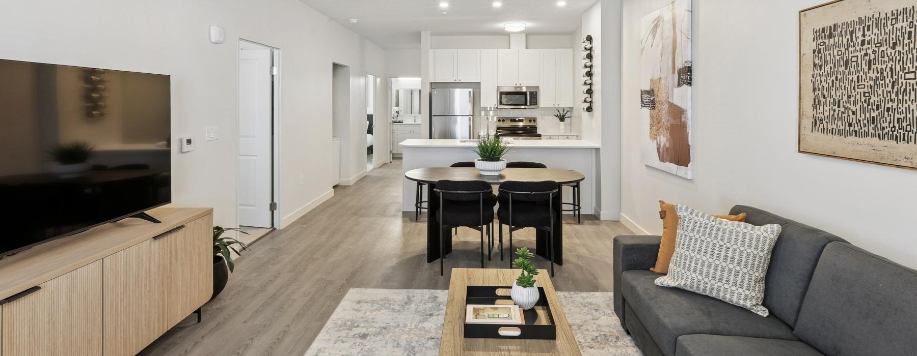 a living room with a table and chairs